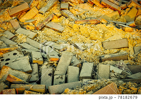 Damaged pavement of gray bricks and yellow sand base, repair street area road works 78182679