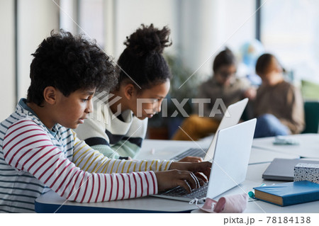 Kids Using Laptop in School Side View Kids Using Laptop in School Side View 78184138