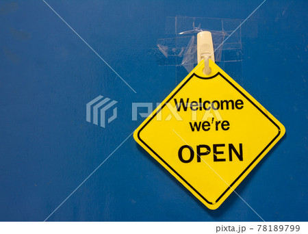 open against a blue door 78189799