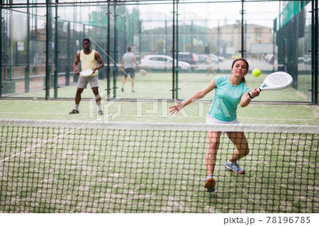 Two sports women playing padel on tennis court Two sports women playing padel on tennis court 78196785