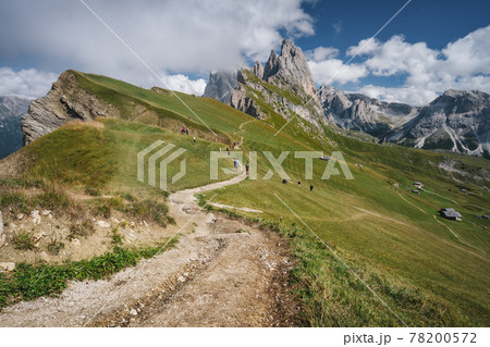 Hiking path and epic landscape of Seceda peak in Dolomites Alps, Odle mountain range, South Tyrol, Italy, Europe. Hiking path and epic landscape of Seceda peak in Dolomites Alps, Odle mountain range, South Tyrol, Italy, Europe. 78200572