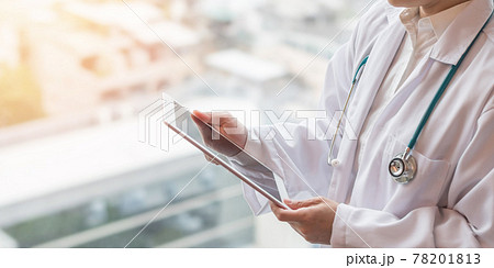 Medical doctor with telehealth consulting patient health online using mobile digital tablet for telemedicine in hospital for professional emergency tele-medicine healthcare assistance service Medical doctor with telehealth consulting patient health online using mobile digital tablet for telemedicine in hospital for professional emergency tele-medicine healthcare assistance service 78201813