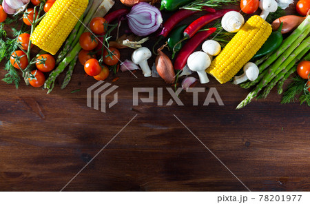 Wooden background with vegetables, mushrooms, greens 78201977