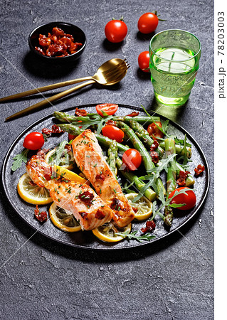 grilled salmon fillets with lemon, bacon,vegetables grilled salmon fillets with lemon, bacon,vegetables 78203003