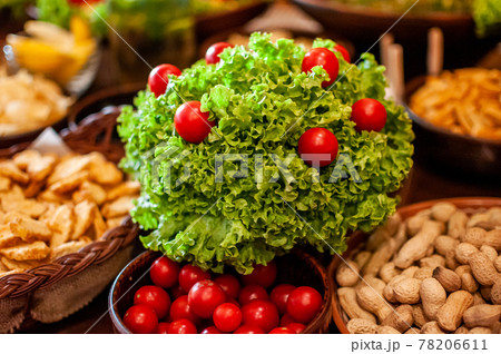 Snack with tomatoes and lettuce and nuts 78206611