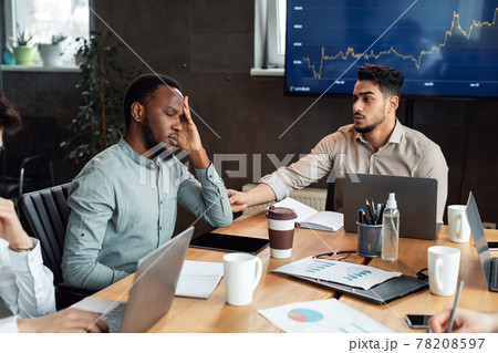 Sick young black male worker suffering from headache 78208597