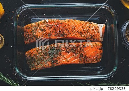 Raw salmon with spices on pan Raw salmon with spices on pan 78209323
