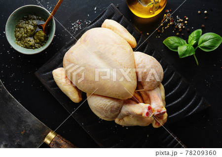 Raw whole chicken on table Raw whole chicken on table 78209360