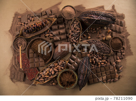 Assorted chocolate bar, candy sweet, cocoa pod, natural paper background 78211090
