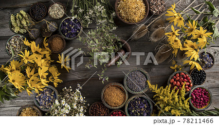 Natural remedy and wooden table background Natural remedy and wooden table background 78211466