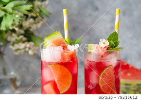 Summer watermelon refreshing drink with lime and soda. Delicious cocktail cold fruit drink. 78215612