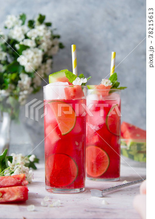 Summer watermelon refreshing drink with lime and soda. Delicious cocktail cold fruit drink. 78215613