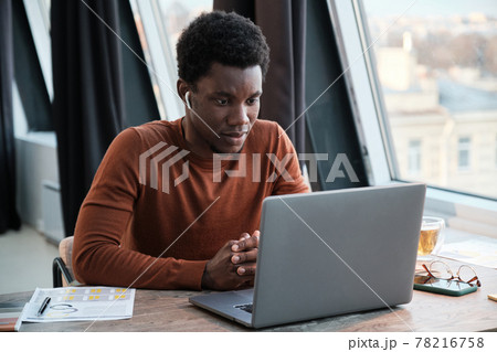Businessman working on computer at office Businessman working on computer at office 78216758