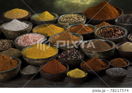 Aromatic spices on wooden background Aromatic spices on wooden background 78217574
