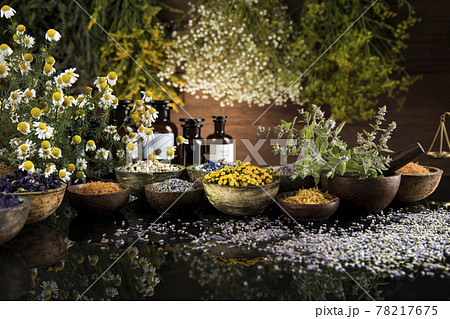Black mirror background, Natural remedy, healing herbs Black mirror background, Natural remedy, healing herbs 78217675