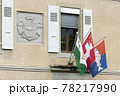 coast of arms and flags on a facade in Nyon, switzerland	 78217990