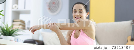 Woman in sportswear for doing fitness at home Woman in sportswear for doing fitness at home 78218407