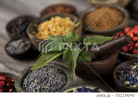 Natural remedy and wooden table background Natural remedy and wooden table background 78219040