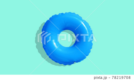 Blue inflatable swimming pool ring on blue background. Blue inflatable swimming pool ring on blue background. 78219708