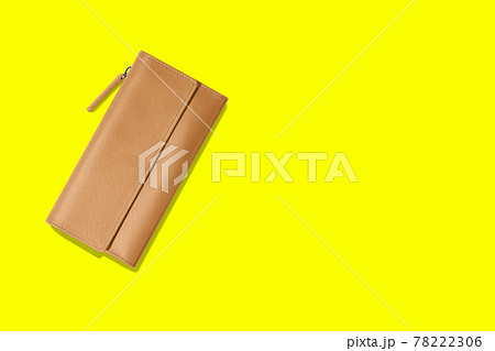 Fashionable leather women's wallet on a yellow background. added copy space for text. 78222306