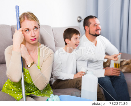 Sad woman tired after cleaning Sad woman tired after cleaning 78227186