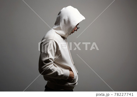 Man in Hood and sunglasses. stylish Boy in a hooded sweatshirt 78227741