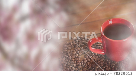 Composition of red cup of coffee with coffee beans forming heart over wooden surface with copy space Composition of red cup of coffee with coffee beans forming heart over wooden surface with copy space 78229612