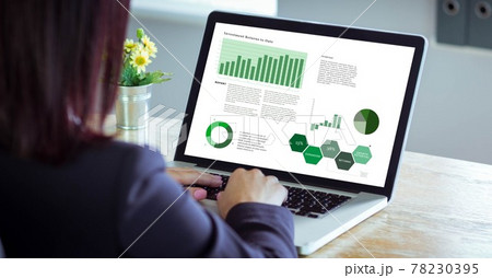 Composition of person at desk using laptop, with research data interface screen Composition of person at desk using laptop, with research data interface screen 78230395