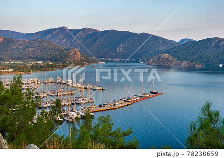 View from the height of the many luxury boats and yachts in the marina at sunset in the Mediterranean Sea.Mugla.Turkey View from the height of the many luxury boats and yachts in the marina at sunset in the Mediterranean Sea.Mugla.Turkey 78230659