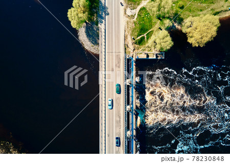 Car moving on bridge in europe small town, aerial view 78230848