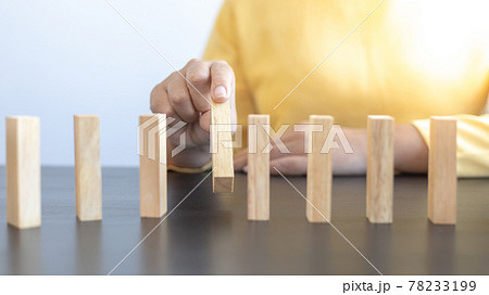 Strategies and risks of wooden games, Close-up of business people gambling with investment risk, Business people play wooden games to simulate planning and strategy for managing business risk. 78233199