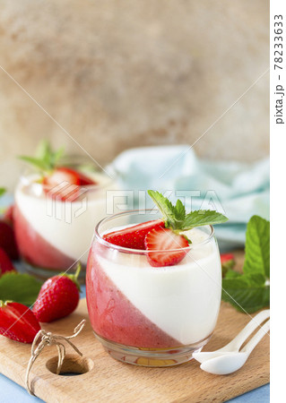 Mango Panna Cotta with jelly and mint strawberries, Italian dessert, home cooking. Copy space. Mango Panna Cotta with jelly and mint strawberries, Italian dessert, home cooking. Copy space. 78233633