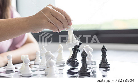 Businesswoman holding chess to take down opposing players, Proactive business planning and marketing strategy just like playing chess, Business competition and success, Leadership concept. 78233904