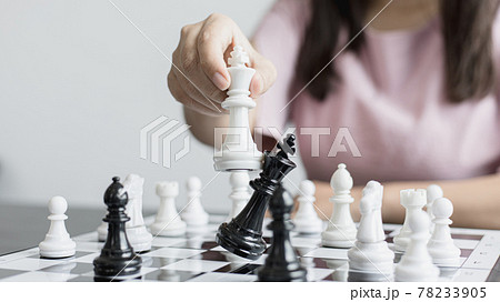 Businesswoman holding chess to take down opposing players, Proactive business planning and marketing strategy just like playing chess, Business competition and success, Leadership concept. Businesswoman holding chess to take down opposing players, Proactive business planning and marketing strategy just like playing chess, Business competition and success, Leadership concept. 78233905