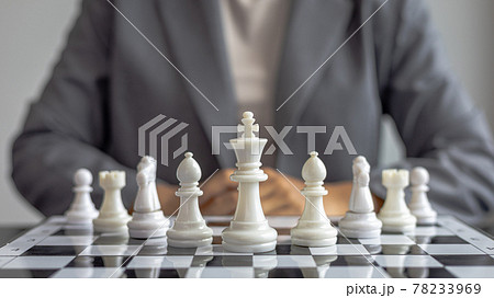 Businesswoman holding chess to take down opposing players, Proactive business planning and marketing strategy just like playing chess, Business competition and success, Leadership concept. 78233969