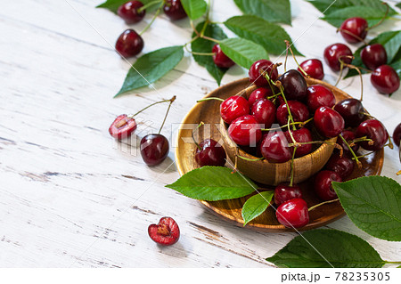 Juicy berry cherry in a bowl on a kitchen rustic table. Copy space. 78235305