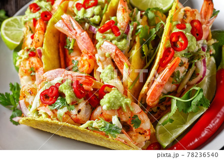 taco shells with shrimps on a plate 78236540
