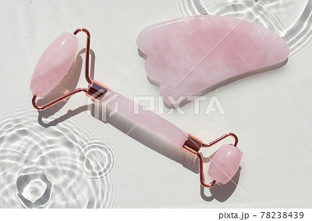 Quartz roller and guasa on abstract water texture, surface with rings and ripple Quartz roller and guasa on abstract water texture, surface with rings and ripple 78238439