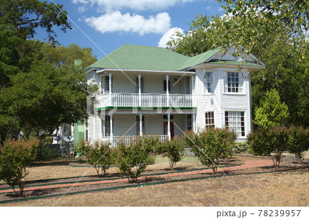 Large Historic Mansion With Green Lawn and Trees 78239957