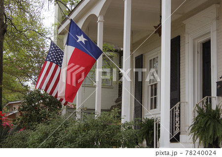 Historic Home With Texas and American Flags 78240024