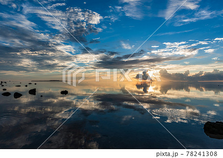 Gorgeous sunrise in blue tones reflected on sea like a mirror. Iriomote Island. 78241308