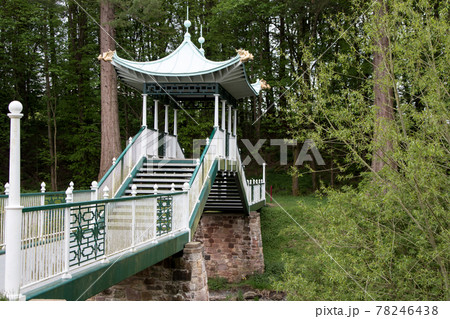 Japanese Style Footbridge Spanning a River in a Public Country Park Japanese Style Footbridge Spanning a River in a Public Country Park 78246438