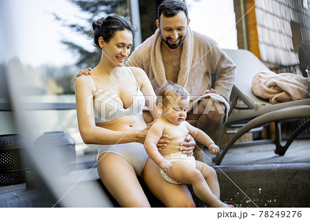 Family at spa with a young baby 78249276