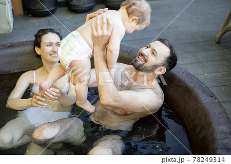 Family at spa with a young baby 78249314