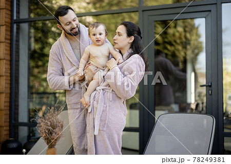 Young family with a one year baby boy resting at Spa resort Young family with a one year baby boy resting at Spa resort 78249381