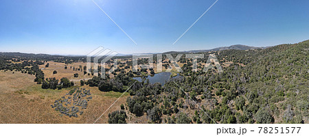 Aerial view of small lake in the valley, between farmland and forest in the town of Julian, east of San Diego, Aerial view of small lake in the valley, between farmland and forest in the town of Julian, east of San Diego, 78251577