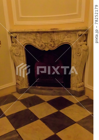 Vintage fireplace in a living room 78252179