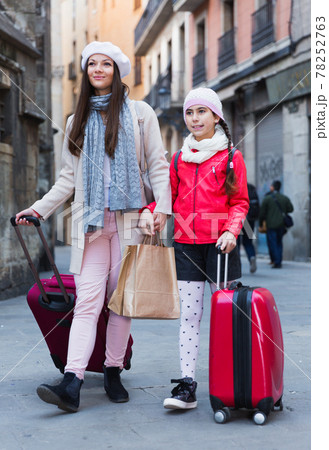 female and child girl going with baggage female and child girl going with baggage 78252763