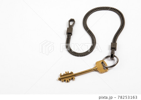 Home key with black metal chain. Copy space 78253163