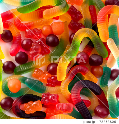 Pattern of colorful gummy bears and worms against white background top view. 78253806